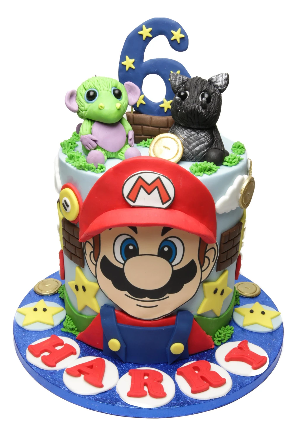 Mario-themed birthday cake with dragon figures, stars and a number six topper