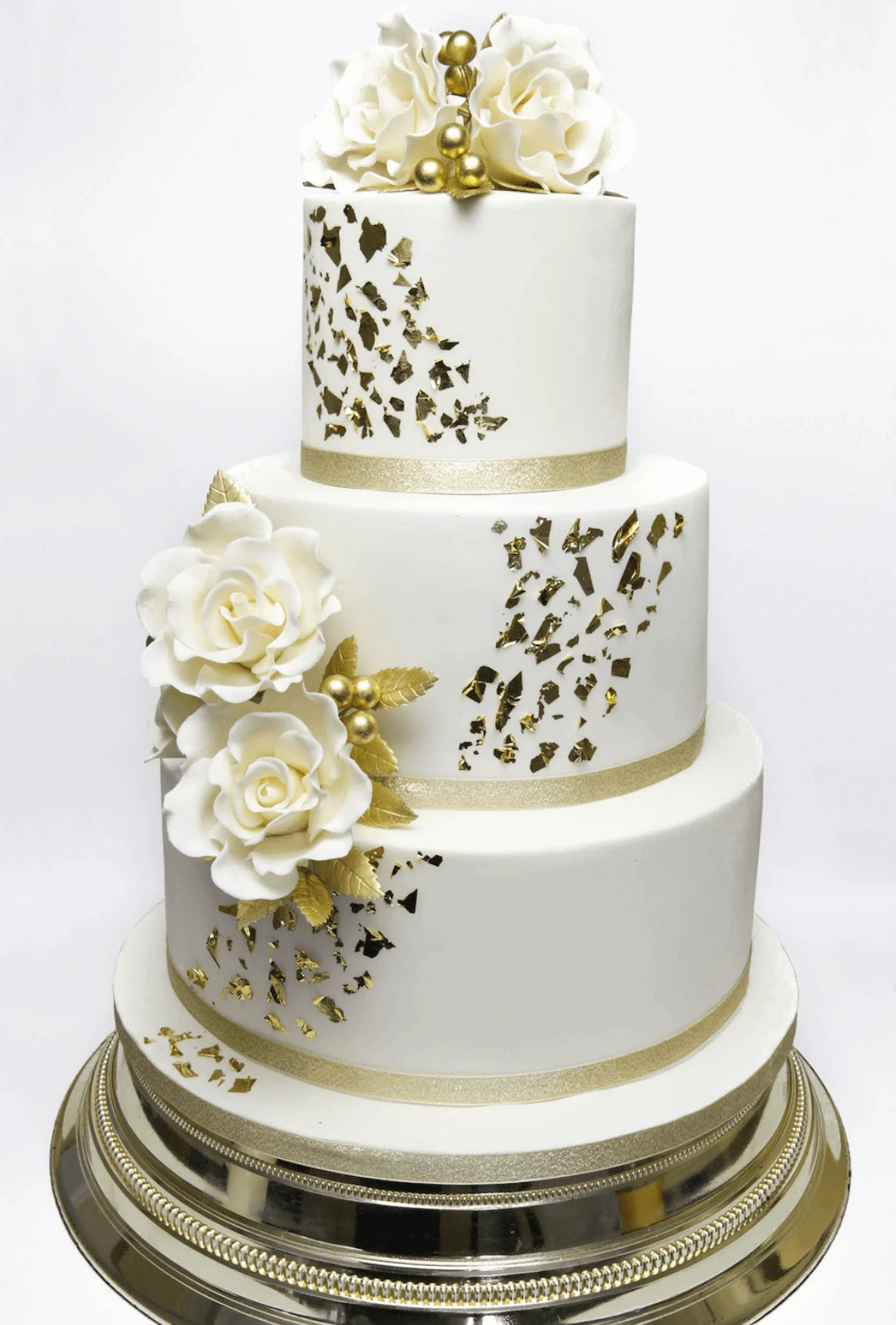 Elegant white bespoke wedding cake with floral details by Anne Robinson, a luxury cake designer in Cambridgeshire – Wedding Cake Design 8